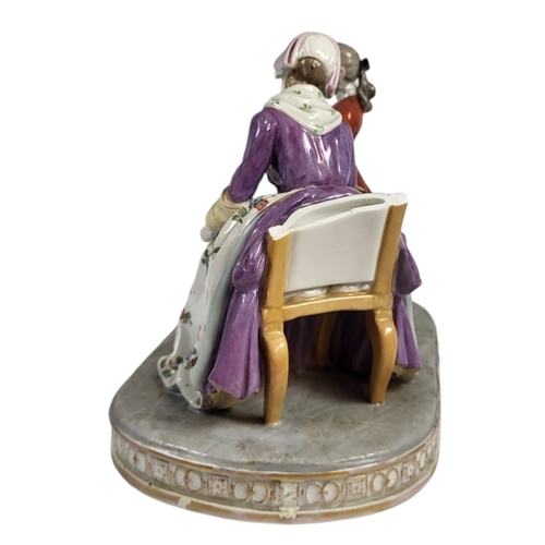 709 - A 19TH CENTURY CONTINENTAL PORCELAIN FIGURAL GROUP
Titled ‘La couvernante D’Apres Chardin’, a seated... 