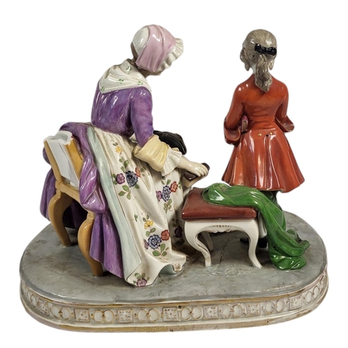 709 - A 19TH CENTURY CONTINENTAL PORCELAIN FIGURAL GROUP
Titled ‘La couvernante D’Apres Chardin’, a seated... 