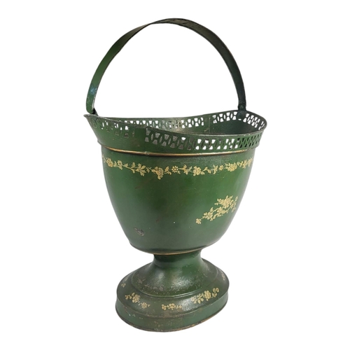 712 - A 19TH CENTURY TOLEWARE BASKET
The single carry handle with hand painted floral decoration on green ... 