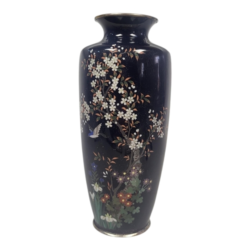 715 - A 19TH CENTURY JAPANESE MEIJI CLOISONNÉ VASE
Fine decoration of an exotic bird with fauna, on a dark... 