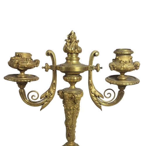 716 - A PAIR OF 19TH CENTURY GILT BRONZE AND MARBLE CANDELABRA
Twin branch arms with rams head motifs with... 