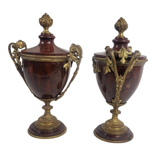 730 - WITHDRAWN A PAIR OF 19TH CENTURY GILT BRONZE AND MARBLE CASSOLETTES
Urn form with gilt bronze finial... 