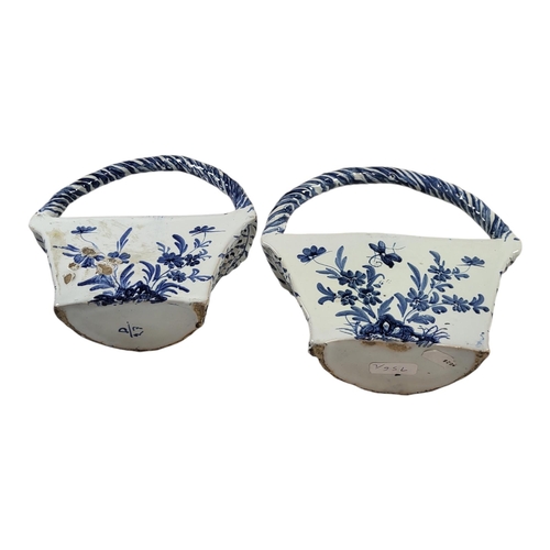 756 - A PAIR OF EARLY 20TH CENTURY BLUE AND WHITE DELFTWARE POTTERY WALL POCKETS/BASKETS
Having a single c... 