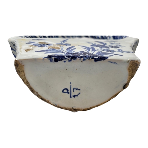 756 - A PAIR OF EARLY 20TH CENTURY BLUE AND WHITE DELFTWARE POTTERY WALL POCKETS/BASKETS
Having a single c... 