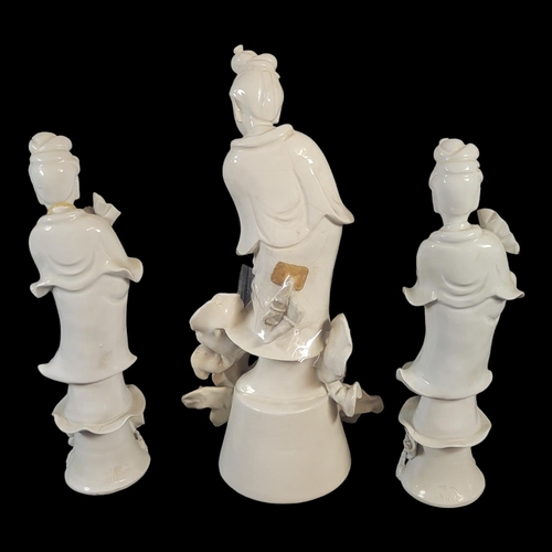 793 - A SET OF THREE LATE QING DYNASTY CHINESE BLANC DE CHINE FIGURES OF GUANYIN, GODDESS OF MERCY
In trad... 