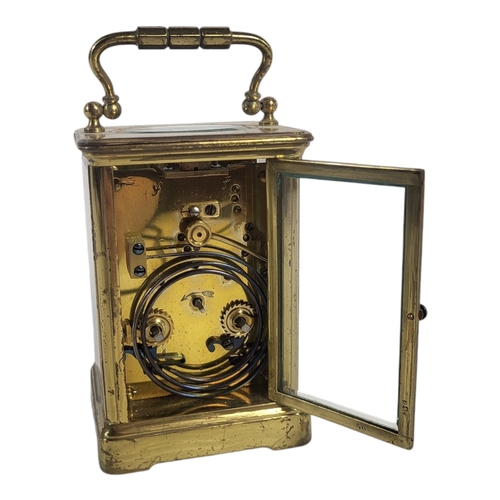 799 - A 20TH CENTURY FRENCH GILT BRASS CARRIAGE CLOCK
Having a single carry handle and four bevelled glass... 