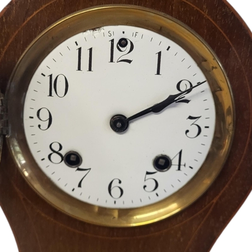 842 - AN EDWARDIAN MAHOGANY INLAID ‘BALLOON’ BEDROOM CLOCK
Having inlaid shell design to case, striking mo... 