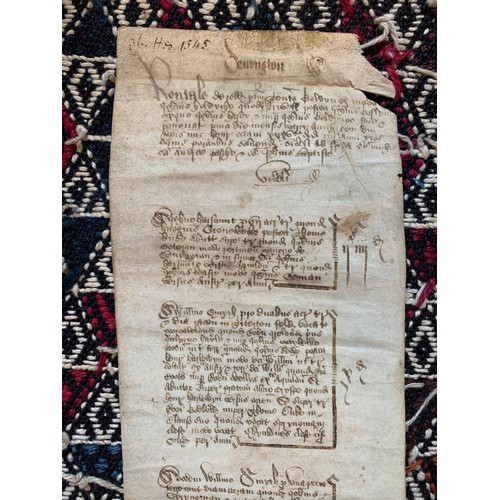 130 - A 16TH CENTURY LEGAL DOCUMENT ON VELLUM, DATED 1545.
(h 61cm x w 10.5cm)