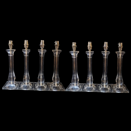 102 - A SET OF EIGHT VINTAGE LUCITE AND CHROME BULBOUS TABLE LAMPS
On square bases.
(approx 34cm)

Conditi... 