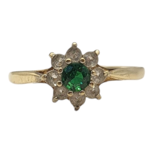 30 - A VINTAGE 9CT GOLD DAISY CLUSTER RING
Having an arrangement of round cut stones forming a daisy clus... 