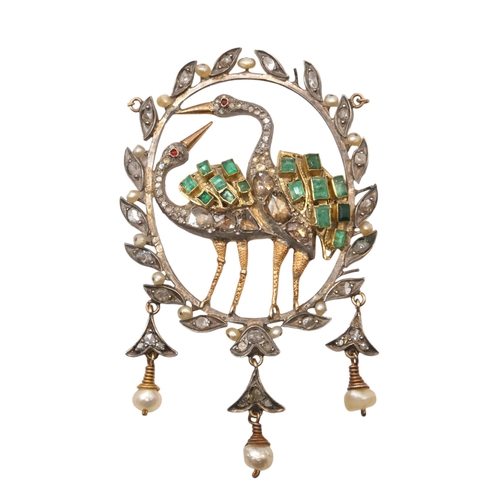 35 - A YELLOW METAL, EMERALD, DIAMOND AND SEED PEARL PENDANT
Two exotic birds set with old cut emeralds a... 