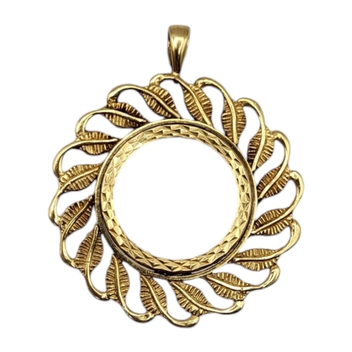 4 - A VINTAGE 9CT GOLD PENDANT COIN MOUNT
The pierced leaf design on a fine box link chain.
(pendant app... 