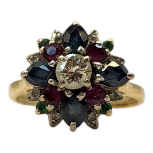 6 - A VINTAGE 18CT GOLD, DIAMOND AND GEM SET ‘TUTTI FRUTTI’ RING
The central round cut diamond edged wit... 