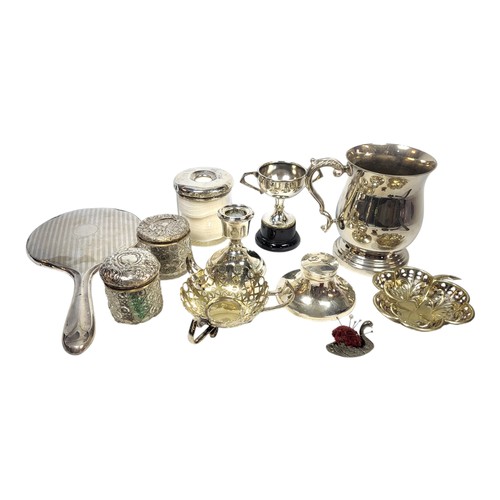 39 - A MATCHED SET OF EARLY 20TH CENTURY SILVER VANITY WARE
Comprising a hand mirror, three trinket bottl... 