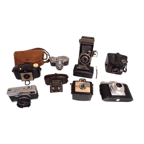 180F - KODAK, OLYMPUS, CORONET, BENCINI, AGFA. A collection of 8 cameras including a Brownie 127 and case, ... 