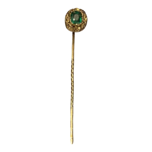 20A - A 19TH CENTURY YELLOW METAL AND EMERALD STICK PIN
Having a central stone with scrolled edge.
(approx... 