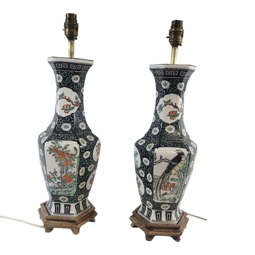 204 - A PAIR OF 20TH CENTURY CHINESE FAMILLE VERTE HEXAGONAL PORCELAIN LAMP BASES
Enamelled with panels of... 