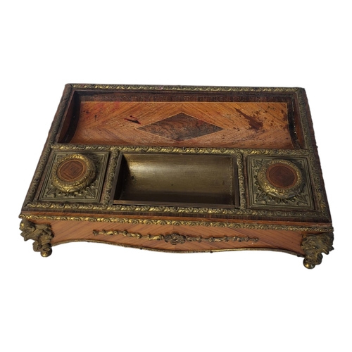 237 - A FINE 19TH CENTURY FRENCH EMPIRE STYLE TULIPWOOD VENEERED ORMOLU MOUNTED TABLETOP INKSTAND
With two... 