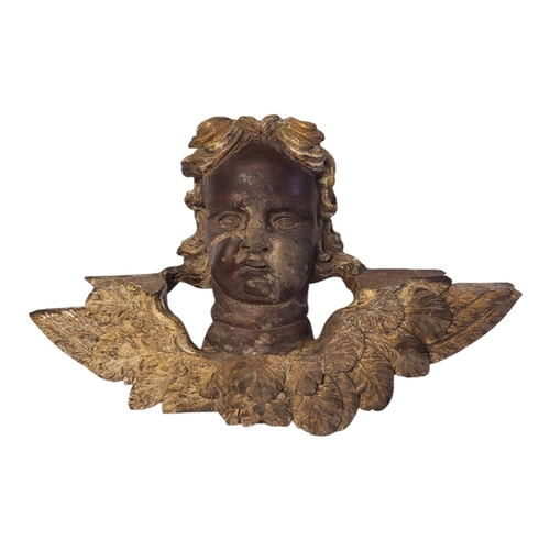 236 - AN 18TH/EARLY 19TH CENTURY CENTRAL EUROPEAN LIMEWOOD PARCEL GILT CARVED BUST OF RUBENS WINGED CHERUB... 