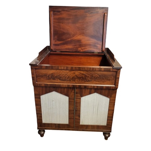 466 - A 19TH CENTURY FLAME MAHOGANY WASHSTAND
The rise and fall top above two silk lined pointed arched do... 