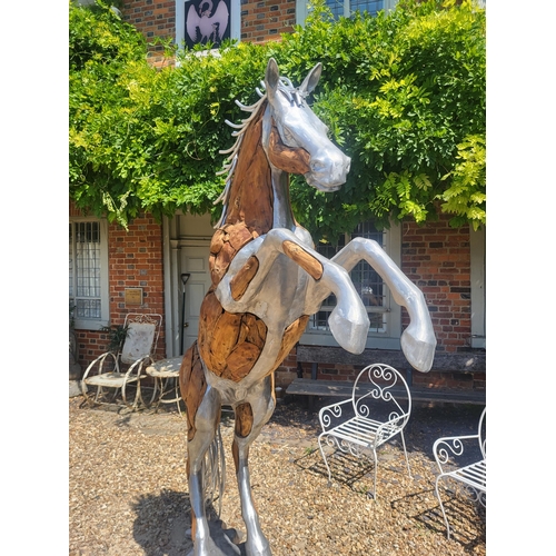 474 - AN IMPRESSIVE LIFE SIZE CAST ALUMINIUM AND DRIFTWOOD RUSTIC SCULPTURE OF A REARING THOROUGHBRED HORS... 