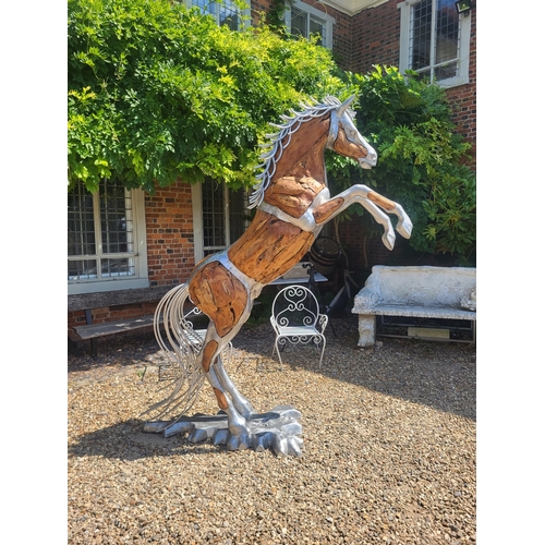 474 - AN IMPRESSIVE LIFE SIZE CAST ALUMINIUM AND DRIFTWOOD RUSTIC SCULPTURE OF A REARING THOROUGHBRED HORS... 