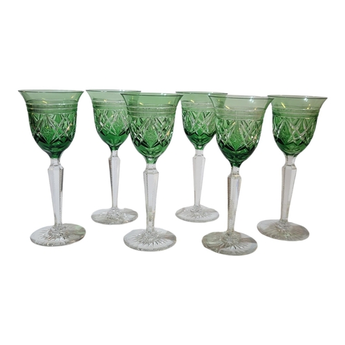 108 - A SET OF SIX BOHEMIAN GREEN FLASHED CUT CRYSTAL HOCK WINE GLASSES
With diamond cut bands and star cu... 