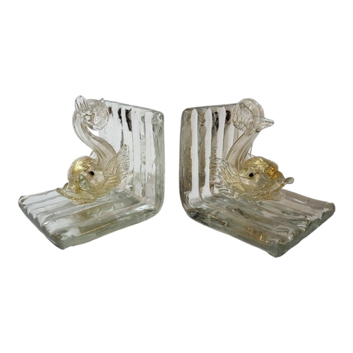 112 - AN ART DECO PERIOD HAND BLOWN MURANO GLASS DOLPHIN BOOKENDS
Both with moulded clear glass, enriched ... 