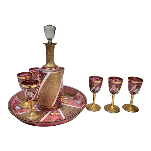 113A - A FINE BOHEMIAN PINK FLASHED GLASS JEWELLED OVERLAID LIQUER DRINKING SET FOR SIX, CIRCA 1900
Decorat... 