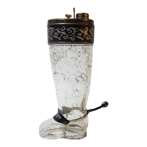 116 - AN EARLY 20TH CENTURY CONTINENTAL NOVELTY MUSICAL GLASS DECANTER MODELLED AS A RIDING BOOT, CIRCA 19... 