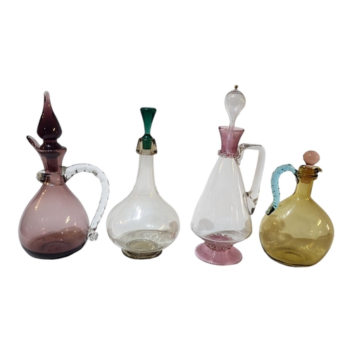 121 - AN EARLY 20TH CENTURY MURANO DECANTER AND STOPPER
With mounted pink flashed rim and base, having han... 