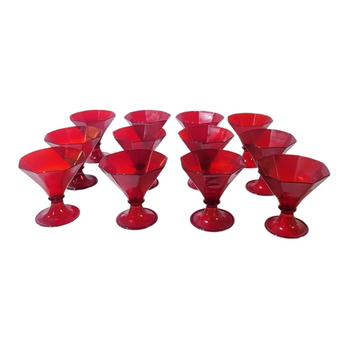 123 - A SET OF TWELVE MURANO ART DECO SHAPED IRON RED RUMMERS/WINE GLASSES
Each having octagonal shaped bo... 