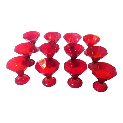 123 - A SET OF TWELVE MURANO ART DECO SHAPED IRON RED RUMMERS/WINE GLASSES
Each having octagonal shaped bo... 