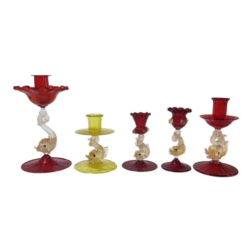 127 - A SET OF FIVE MURANO VARIOUS ART GLASS HAND BLOWN SINGLE CANDLESTICKS 
All stems, moulded and suppor... 