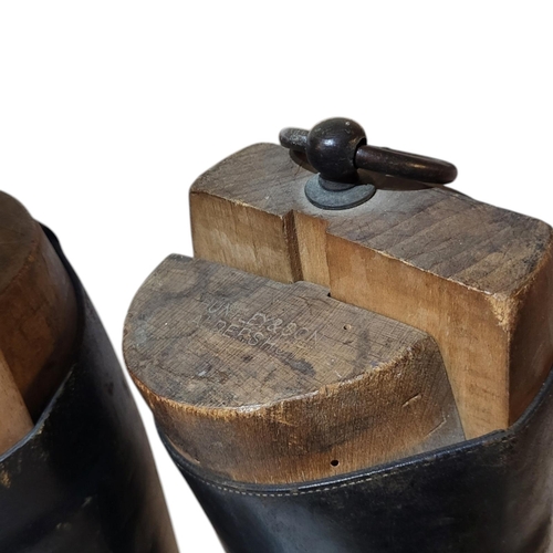 134 - A PAIR OF EARLY 20TH CENTURY LEATHER RIDING BOOTS
Complete with wooden boot trees, marked ‘Huntley a... 