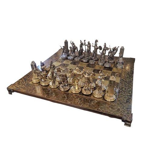 141 - MANOPOULOS, A 20TH CENTURY GREEK METALLIC CHESS SET
Modelled as Ancient Greek warriors, in gilt and ... 