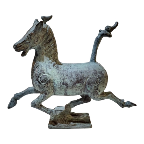 142 - A VINTAGE CHINESE SOLID VERDIGRIS BRONZE ‘FLYING HORSE OF GANSU’ FIGURE
Prancing horse standing on a... 