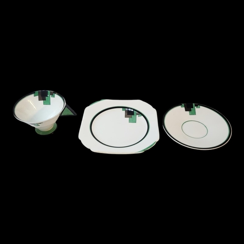 148 - A SHELLEY ART DECO VOGUE PATTERN BONE CHINA TRIO
In green, black and silver block motifs, designed b... 