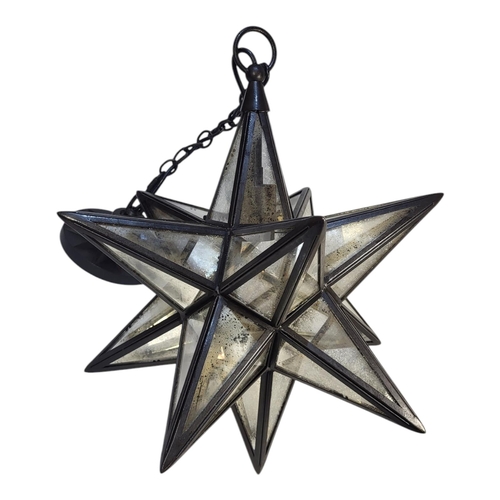 150 - A VICTORIAN STYLE STEEL AND PLANISHED MIRRORED LANTERN
In the form of a twelve pointed star.
(40cm x... 