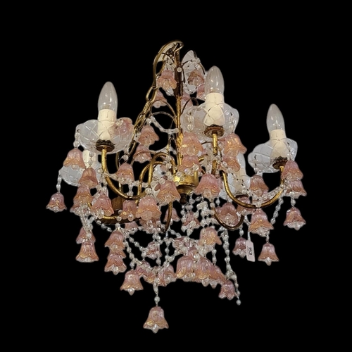 153 - A VENETIAN GILT METAL SIX BRANCH CHANDELIER
Hung with clear prisms and pink a gold floral bells
(dia... 