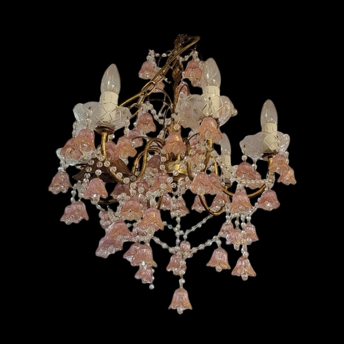 153 - A VENETIAN GILT METAL SIX BRANCH CHANDELIER
Hung with clear prisms and pink a gold floral bells
(dia... 