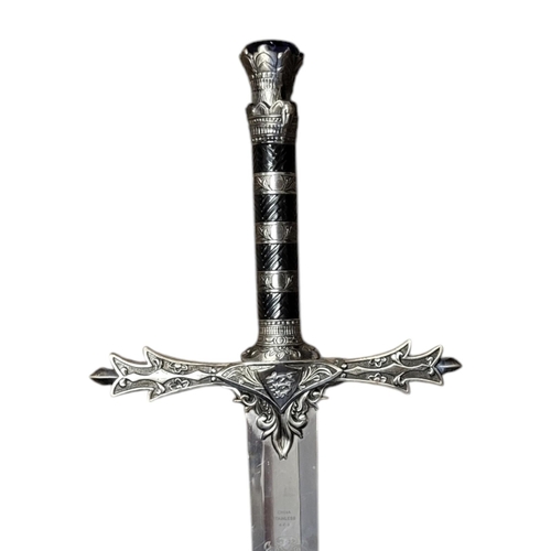 156 - A THEATRICAL POLISHED AND PATINATED STEEL SWORD
With faux sapphire inset pommel.
(119cm)