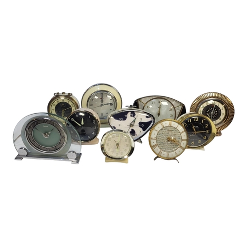 169 - A COLLECTION OF TEN MID CENTURY ALARM AND MANTLE CLOCKS
To include glass and chrome ingersoll, Westc... 