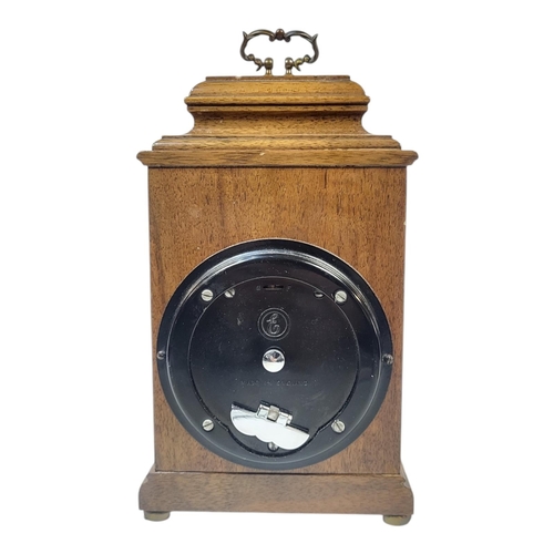 171 - A MID CENTURY WALNUT MANTEL CLOCK
The single brass handle, brass dial marked ‘Tempus Fugit Tarratt E... 