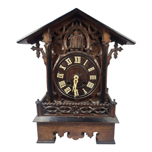 173 - A 19TH CENTURY OAK SWISS BLACK FOREST CUCKOO CLOCK
Architectural form with carved gallery, two bello... 