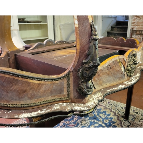 400 - IVOR NOVELLO’S WRITING TABLE, A 19TH CENTURY FRENCH KINGWOOD AND GILT BRONZE MOUNTED
The banded cart... 