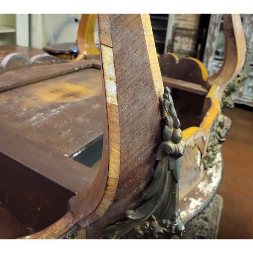 400 - IVOR NOVELLO’S WRITING TABLE, A 19TH CENTURY FRENCH KINGWOOD AND GILT BRONZE MOUNTED
The banded cart... 