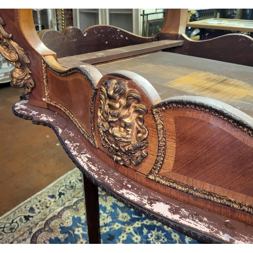 400 - IVOR NOVELLO’S WRITING TABLE, A 19TH CENTURY FRENCH KINGWOOD AND GILT BRONZE MOUNTED
The banded cart... 