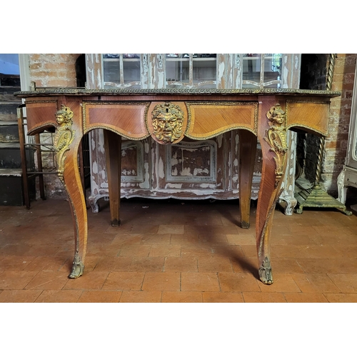 400 - IVOR NOVELLO’S WRITING TABLE, A 19TH CENTURY FRENCH KINGWOOD AND GILT BRONZE MOUNTED
The banded cart... 