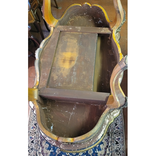 400 - IVOR NOVELLO’S WRITING TABLE, A 19TH CENTURY FRENCH KINGWOOD AND GILT BRONZE MOUNTED
The banded cart... 